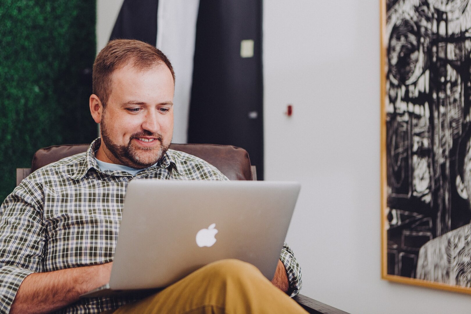 Man with laptop doing code-review